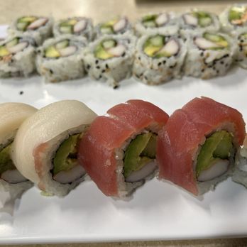 AT Sushi - a variety of sushi rolls on a white plate - Sushi Bars Near Me - Syracuse, New York