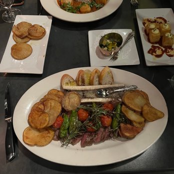 OTRA Restaurant - Scallops on top and then steak with bone marrow on the bottom and shishito peppers (YUM) - Tapas/Small Plates Near Me - Providence, Rhode Island