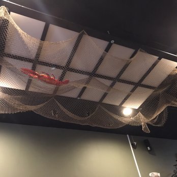 Oceanic Boil - Cute decoration! The lobster in the net - Cajun/Creole Near Me - Jackson Heights, New York