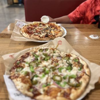 MOD Pizza - two pizzas on a table - Pizza Near Me - Burleson, Texas MOD Pizza - two pizzas on a table - Pizza Near Me - Burleson, Texas
