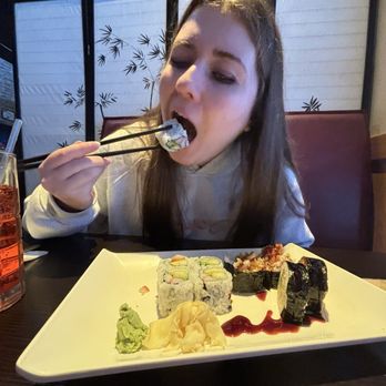 Asian Bistro - girl eating sushi - Chinese Near Me - Williston, Vermont Asian Bistro - girl eating sushi - Chinese Near Me - Williston, Vermont