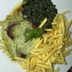 Blockhus - Sirloin steak in herb butter sauce with spinach and pommes frites.