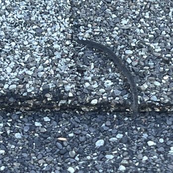 Hoyt Roofs - Broken corner, patched with tar. - Roofing Near Me - Anaheim, California
