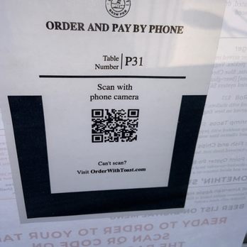 Blue Point Brewing - No need for waitstaff to take your order.  Just scan the barcode with your camera and the link to the menu pops up at the top of your camera - Brewpubs Near Me - Patchogue, New York