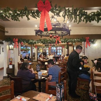 Hot Tamale Holiday UYE - Our waiter, Rubén, worked very diligently to keep our group happy. Room decked with Winter Holiday decorations - Unofficial Yelp Events Near Me