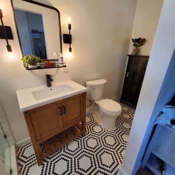 The Handyman Services - a bathroom with black and white tile - Handyman Near Me - Richmond, California The Handyman Services - a bathroom with black and white tile - Handyman Near Me - Richmond, California