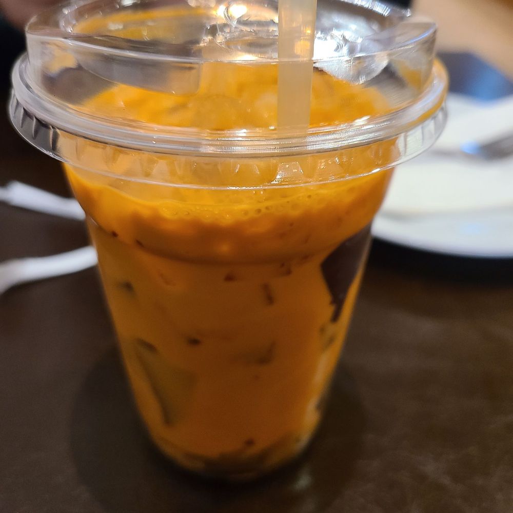 Saigon Grace Cafe - Thai milk tea with chocolate crunchies (cup is lined with chocolate that you break and mix!) - Cafes Near Me - Philadelphia, Pennsylvania Saigon Grace Cafe - Thai milk tea with chocolate crunchies (cup is lined with chocolate that you break and mix!) - Cafes Near Me - Philadelphia, Pennsylvania