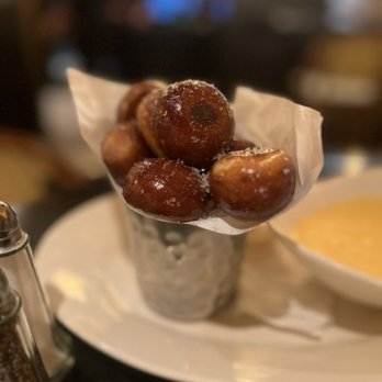 The Cheesecake Factory - pretzel bites with cheddar cheese fondue: baked soft with warm + cheddar cheese sauce =. $9.95 - American Near Me - Phoenix, Arizona The Cheesecake Factory - pretzel bites with cheddar cheese fondue: baked soft with warm + cheddar cheese sauce =. $9.95 - American Near Me - Phoenix, Arizona