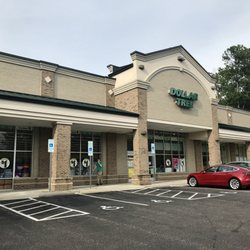 Dollar Tree - Only in Cary would there be a Tesla in the parking lot!