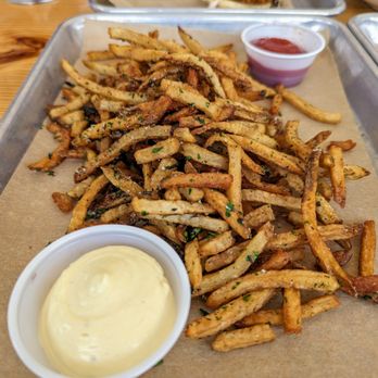 Franklin Motors - Hand Cut Fries. $8. Hand-cut potatoes, parsley, rosemary, thyme, and housemade roasted garlic aioli (and ketchup). - Beer Gardens Near Me - Chapel Hill, North Carolina