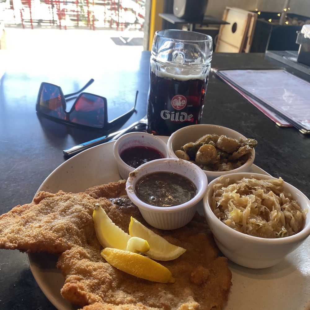 Veal Schnitzel with Sauerkraut, German Potato Salad and gravy. Veal Schnitzel with Sauerkraut, German Potato Salad and gravy.