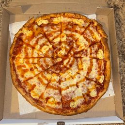 Large cheese pizza with a hot honey drizzle and ricotta