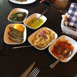 Trata Meyhanesi - A variety of appetizers and dippings for the fresh bread. From fresh hummus, sautéed onions, garlic, sea string beans.