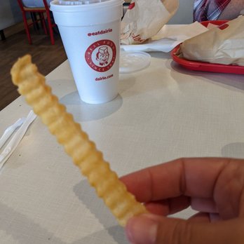Dairi-O - a hand holding a piece of french fries - Fast Food Near Me - Winston-Salem, North Carolina