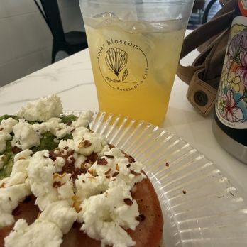Sugar Blossom Bake Shop - Avo Garlic Goat Avocado Toast and POG lemonade - Coffee & Tea Near Me - San Clemente, California Sugar Blossom Bake Shop - Avo Garlic Goat Avocado Toast and POG lemonade - Coffee & Tea Near Me - San Clemente, California