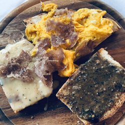 Ristorante Lampino - Appetizer of  toast topped with Polenta and truffle, a fritatta with truffle, and toast topped with black truffle salsa