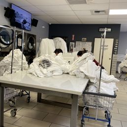 Busy on their phones, not tending to towels in the dryers that are already complete. Making other customers wait. Classless. Busy on their phones, not tending to towels in the dryers that are already complete. Making other customers wait. Classless.