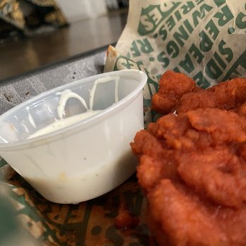 Wingstop - a basket of fried chicken and a bowl of ranch dressing - Chicken Wings Near Me - Manteca, California