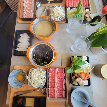 Potto - Sukiyaki nabe with udon (bottom) and spicy miso nabe with udon (top) - Japanese Near Me - San Francisco, California Potto - Sukiyaki nabe with udon (bottom) and spicy miso nabe with udon (top) - Japanese Near Me - San Francisco, California