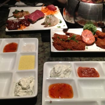 The Melting Pot - The Classic on the left and the French Quarter on the right.   Love the new plates with 6 easy places for the sauces. - Fondue Near Me - Myrtle Beach, South Carolina