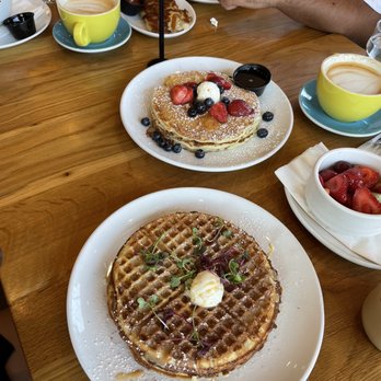 Poached Kitchen - Churro waffles and pancakes for the table are shown here - Breakfast & Brunch Near Me - Irvine, California