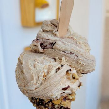 Bacio Di Latte - Crema Torino and their seasonal Tiramisù Double Mascarpone on a Ciocchino Nutella Sugar Cone with nuts. - Gelato Near Me - Irvine, California Bacio Di Latte - Crema Torino and their seasonal Tiramisù Double Mascarpone on a Ciocchino Nutella Sugar Cone with nuts. - Gelato Near Me - Irvine, California