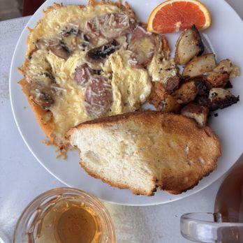 Café Soleil - The brunch special - organic chicken sausage, organic mushroom, and Parmesan frittata w/ roasted potatoes. - Ethiopian Near Me - Seattle, Washington Café Soleil - The brunch special - organic chicken sausage, organic mushroom, and Parmesan frittata w/ roasted potatoes. - Ethiopian Near Me - Seattle, Washington