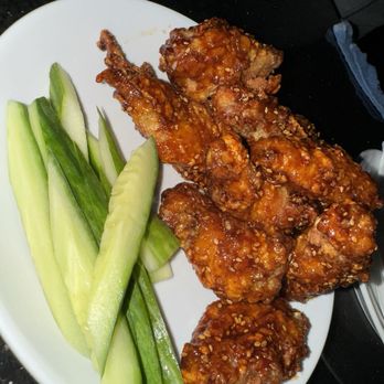 Dusty Vinyl - The Korean style wings ... served hot an juicy with the crispy and cool sliced cucd, definitely a winner - American Near Me - Los Angeles, California