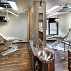 Reilly Dental - Comfortable treatment rooms with the latest technology and televisions on the ceilings for viewing during procedures.