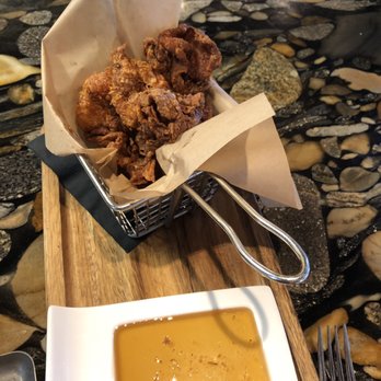 Carson Kitchen - Crispy chicken skin with smoked honey sauce - New American Near Me - Las Vegas, Nevada