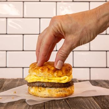 Hardee's - a hand reaching for a breakfast sandwich - Burgers Near Me - Michigan City, Indiana Hardee's - a hand reaching for a breakfast sandwich - Burgers Near Me - Michigan City, Indiana