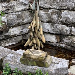 River Gallery Sculpture Garden - Fish diving to water sculpture