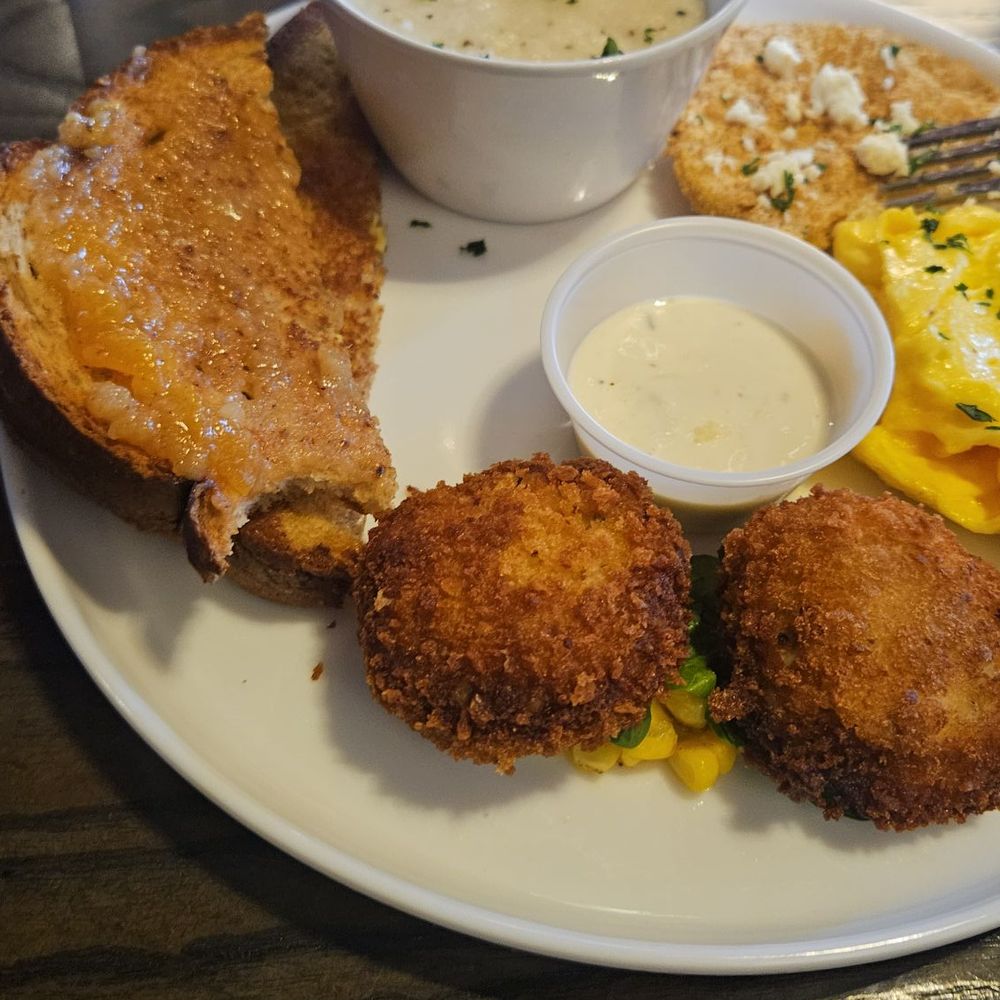 Gocha's Tapas Bar - Crab cakes with eggs and grits. - Tapas Bars Near Me - Atlanta, Georgia Gocha's Tapas Bar - Crab cakes with eggs and grits. - Tapas Bars Near Me - Atlanta, Georgia