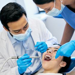 Q Dental - Dr. Lee and the Q Dental team providing gentle dental care and cavity treatment for a patient at our modern Humble, TX office.