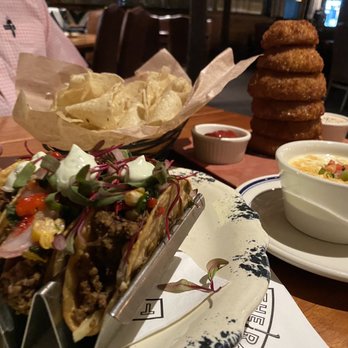 The Ranch - Apps: large onion rings, elk tacos, cheesy dipping sauce with tortilla chips - Steakhouses Near Me - Irving, Texas The Ranch - Apps: large onion rings, elk tacos, cheesy dipping sauce with tortilla chips - Steakhouses Near Me - Irving, Texas