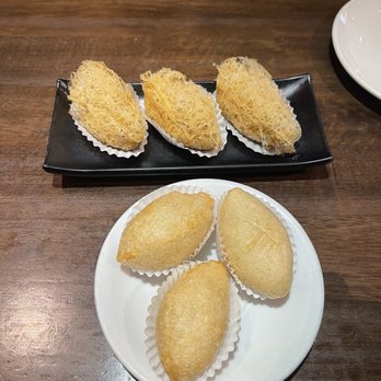 Ty Ginger Asian Bistro - Ham Sui Gok ( Deep fried sticky rice and pork dumplings) ones in the white plate Taro Puffs (taro stuffed with minced pork) - Asian Fusion Near Me - Dublin, Ohio Ty Ginger Asian Bistro - Ham Sui Gok ( Deep fried sticky rice and pork dumplings) ones in the white plate Taro Puffs (taro stuffed with minced pork) - Asian Fusion Near Me - Dublin, Ohio