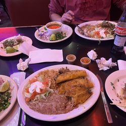 La Palmita Mexican Restaurant - Birria plato, in the back and quesobirria plato in the front. Their rice and beans are amazing too!