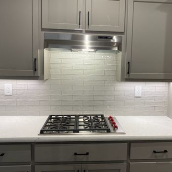 The Cabinet Doctors - The grout matches the cabinet color, which gives it a bit of contrast. - Cabinetry Near Me - Rocklin, California