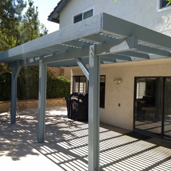 HoN - a patio with a pergolated roof - General Contractors Near Me HoN - a patio with a pergolated roof - General Contractors Near Me