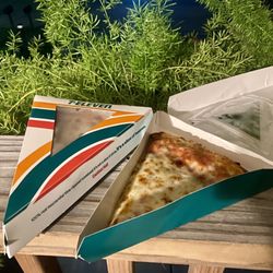 7-Eleven - Old school pizza. Recommend! Reminds me of pizza day in high school.