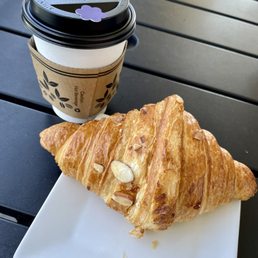 Coconut latte with almond croissant Coconut latte with almond croissant