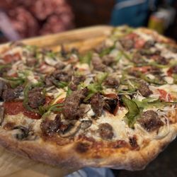 Capone's Italian Pizzeria - House special! The sausage is amazing! Really stood out with the super fresh veggies!