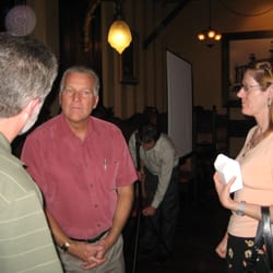 Gene P. Johnson Insurance - Gene visiting with customers.