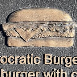 The Birthplace of the Cheeseburger - The Birthplace of the Cheeseburger. A bronze plaque on the ground @ the former Rite Spot in Pasadena. In 1924 Lionel Sternberger created it.