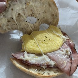 Not sure, I think that's supposed to be a breakfast bagel. I think that yellow thing was made of eggs? ‍