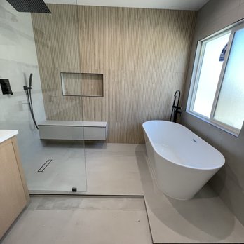 Ecostar Group - a modern bathroom with a freestanding tub - General Contractors Near Me Ecostar Group - a modern bathroom with a freestanding tub - General Contractors Near Me