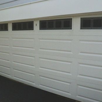 Gridline Shine - A sparkling clean garage door completely transformed the look of this home--professional results you can see! - Pressure Washers Near Me - Brooklyn, New York