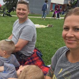 a family sitting on a blanket a family sitting on a blanket