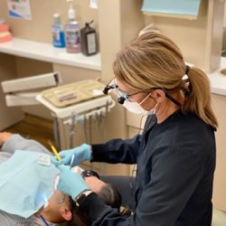 Glen Ellyn Smiles - Tracy cleaning a patient's teeth