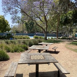 Christine Emerson Reed Park - Three wooden chess tables.